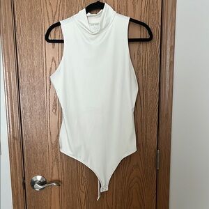 White Sleeveless Mockneck Bodysuit